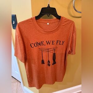 Orange Graphic Tee with 'Come, We Fly' Print
